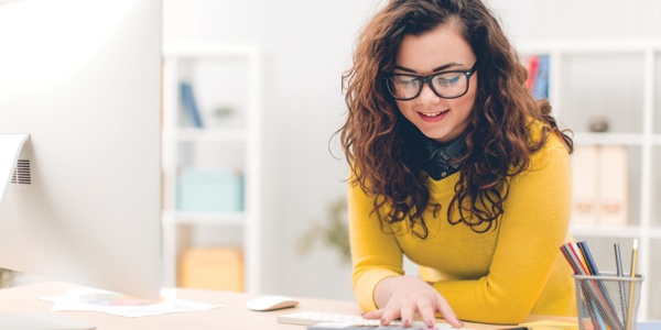 Woman working at an adjustable standing desk